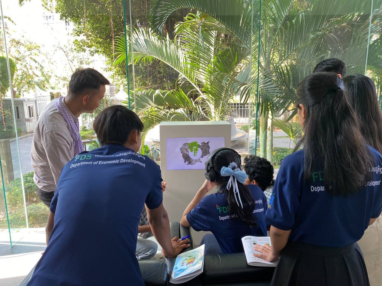 Home Participants reviewing programme posters
